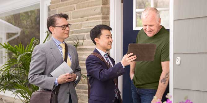 Jehovah's Witnesses going door to door