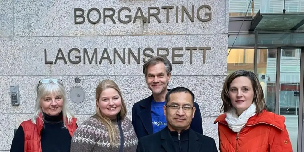 Some former members outside the Borgarting Courthouse in Olso, Norway