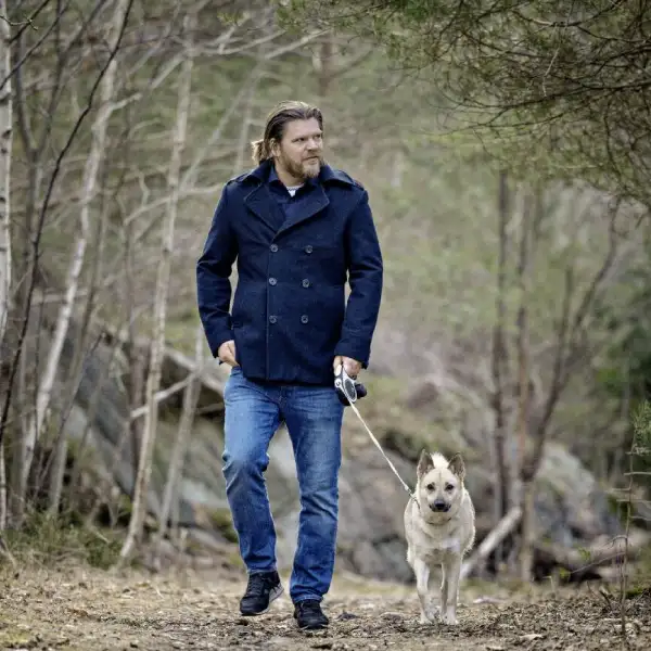 Jan Frode Nilsen with his faithful dog taking a walk in the woods